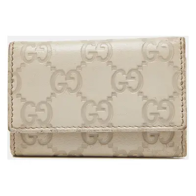 Gucci Beige Guccissima Leather Bow Key Holder