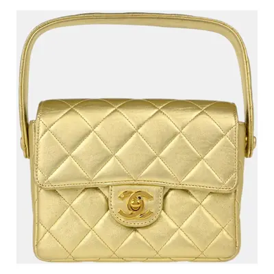 Chanel Gold Lambskin Mini Handbag