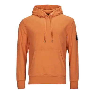 Calvin Klein Jeans BADGE HOODIE men's T shirt in Orange