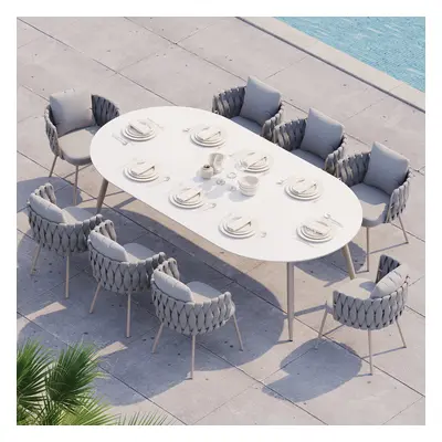 8 Pieces Outdoor Dining Set with Oval Faux Marble Top Table and Rope Woven Armchair